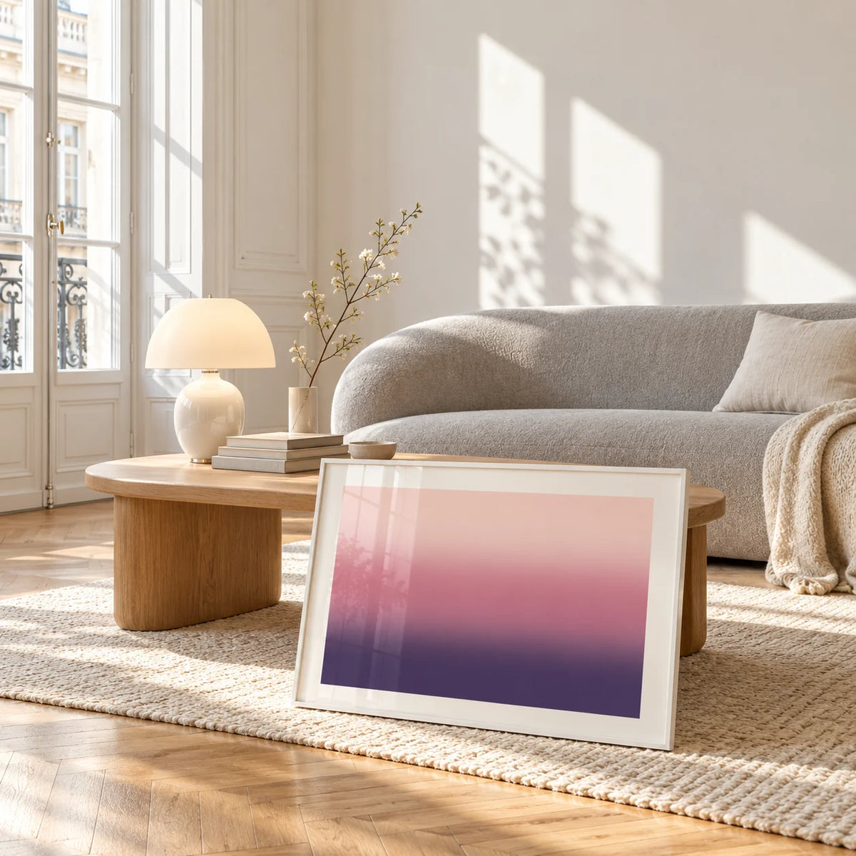 Mauve Print, framed and leaning against a coffee table in a bright living room