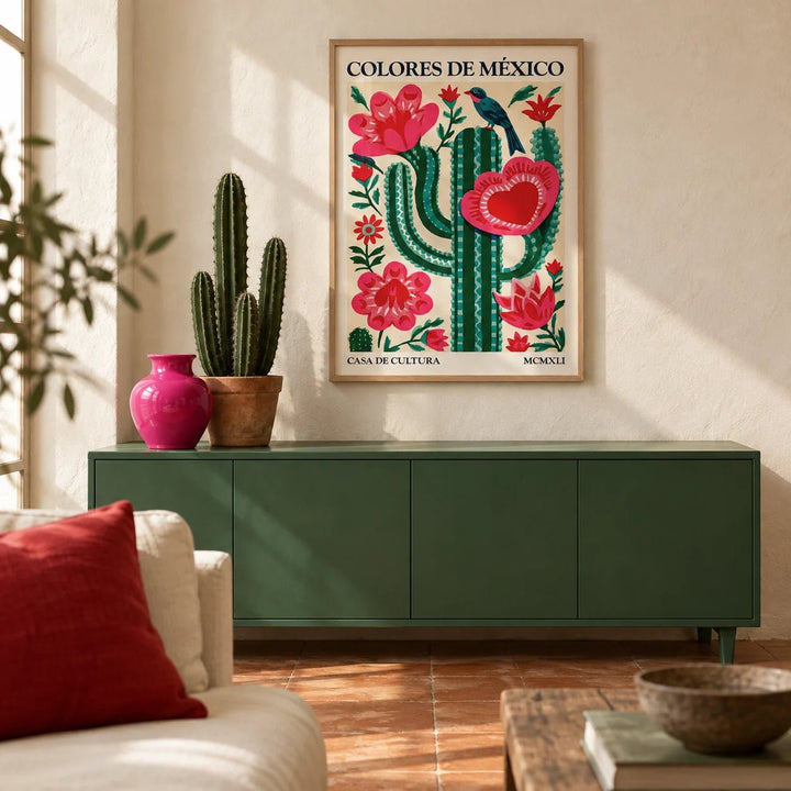 Mexican Folk Art Cactus, framed on the wall of a warm Mexican-modern living room with limewashed warm white plaster walls and a plain terracotta floor