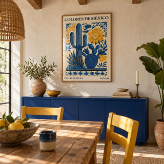 Mexican Folk Art, framed on the wall of a Mexican-modern dining room with limewashed cream walls and wooden ceiling beams