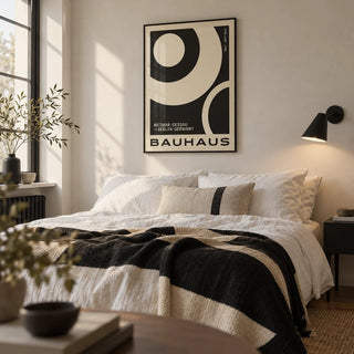 Minimalist Abstract Art Prints, framed on the wall of a crisp monochrome bedroom in a city flat