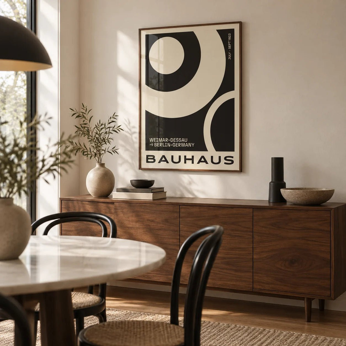 Minimalist Abstract Art Prints, framed on the wall of a modern dining room