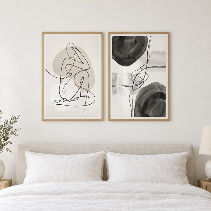 Minimalist Abstract Wall Art Set of 2 hung at eye level above a bed in a calm bedroom: Gentle Pose and Graphite Sonata shown framed side by side (frames not included)