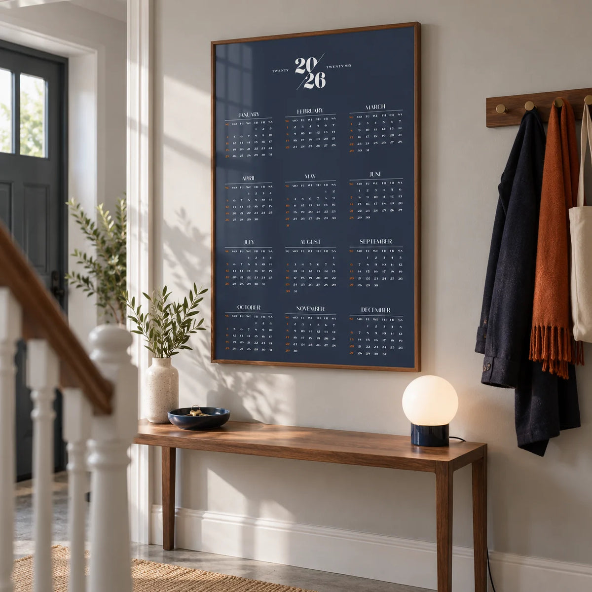 Minimalist Calendar, framed on the wall of a crisp hallway in a renovated UK terrace with pale grey walls and a simple concrete floor