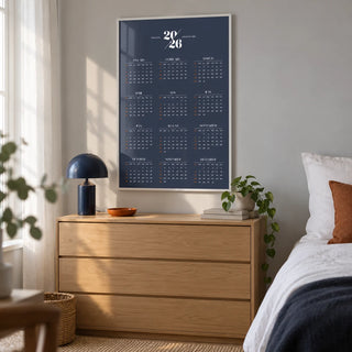 Minimalist Calendar, framed on the wall of a minimalist adult bedroom in a UK flat with a pale grey wall and white curtains