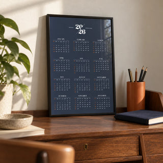 Minimalist Calendar, a small A4 framed print leaning on a walnut secretary desk
