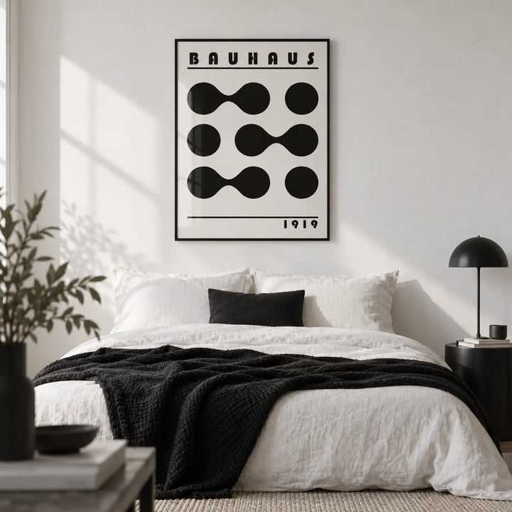 Minimalist Geometric Print, framed on the wall of a monochrome bedroom with a white wall