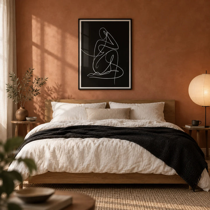 Minimalist Human Form Art Print, framed on the wall of a warm minimal bedroom with a terracotta limewashed wall