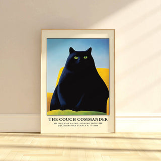 Cat Funny Poster print of a black cat on a yellow couch leaning against a cream wall