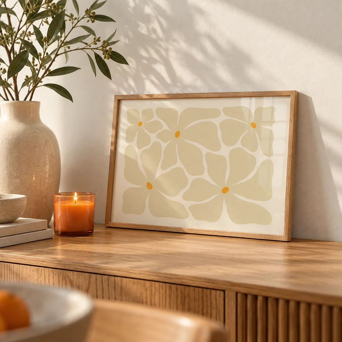 Modern Floral Poster, a small A4 framed print leaning on an oak sideboard in a living room