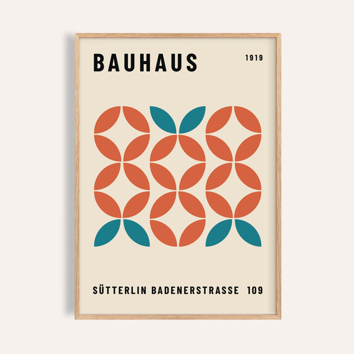 Framed print of Bauhaus modern geometric wall art with teal and rust shapes in a minimalist style