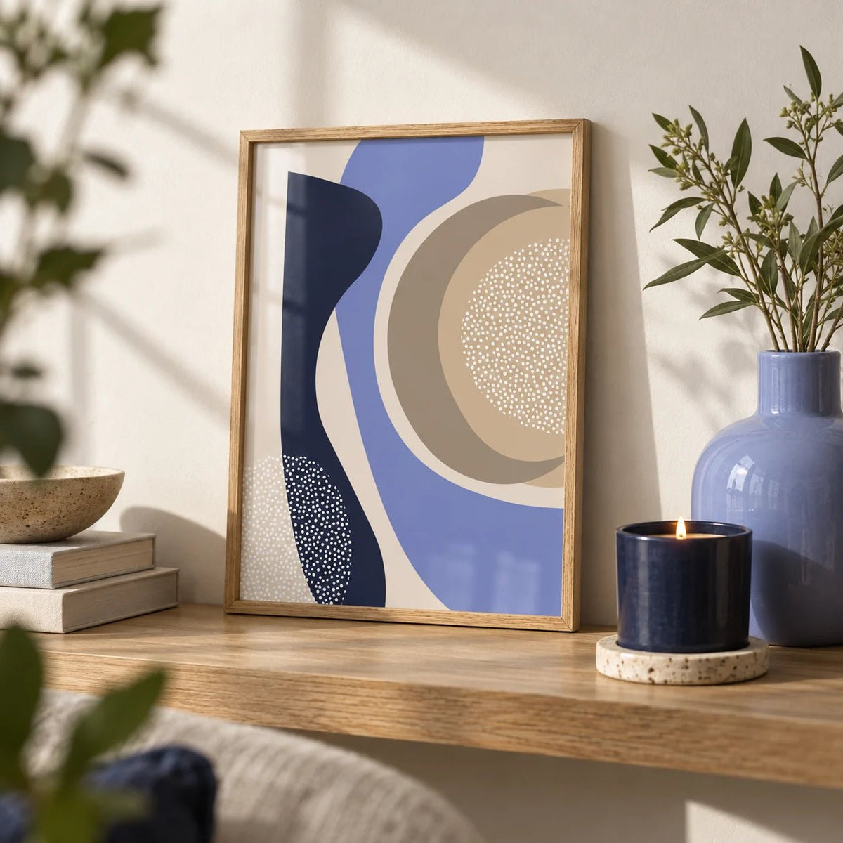 Modern Poster Design, a small A4 framed print leaning on an oak shelf in a living room