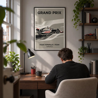 Modern Racing Car Poster, framed on the wall of a compact home study in a UK terrace for a motorsport enthusiast (25-40) with a pale grey wall