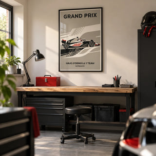 Modern Racing Car Poster, framed on the wall of a tidy converted garage hobby room in a UK home with a smooth ivory wall and a sealed grey concrete floor