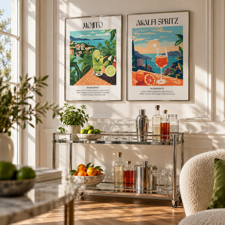 Mojito and Spritz Prints Set of 2 styled above a chrome bar cart with cocktail glasses: Mojito and Amalfi Spritz shown framed side by side (frames not included)