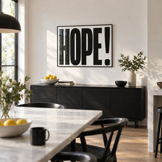 Motivational Work Posters, framed on the wall of a bright kitchen-diner with a white wall