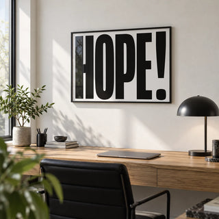 Motivational Work Posters, framed on the wall of a modern home office with a white wall