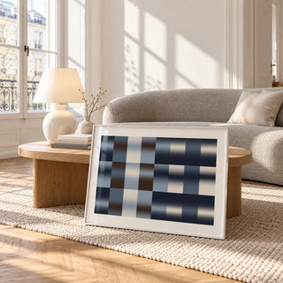 Navy Abstract Wall Art, framed and leaning against a coffee table in a bright living room
