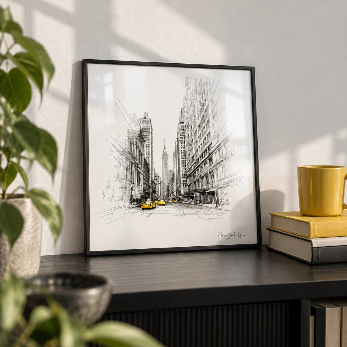 New York City Drawing, a small A4 framed print leaning on a black shelf in a living room