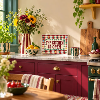 Open Kitchen Harlequin Print, a small A4 framed print leaning on a kitchen worktop