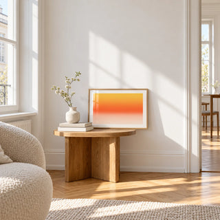 Orange Abstract Wall Art, a small A4 framed print leaning on a small solid oak side table