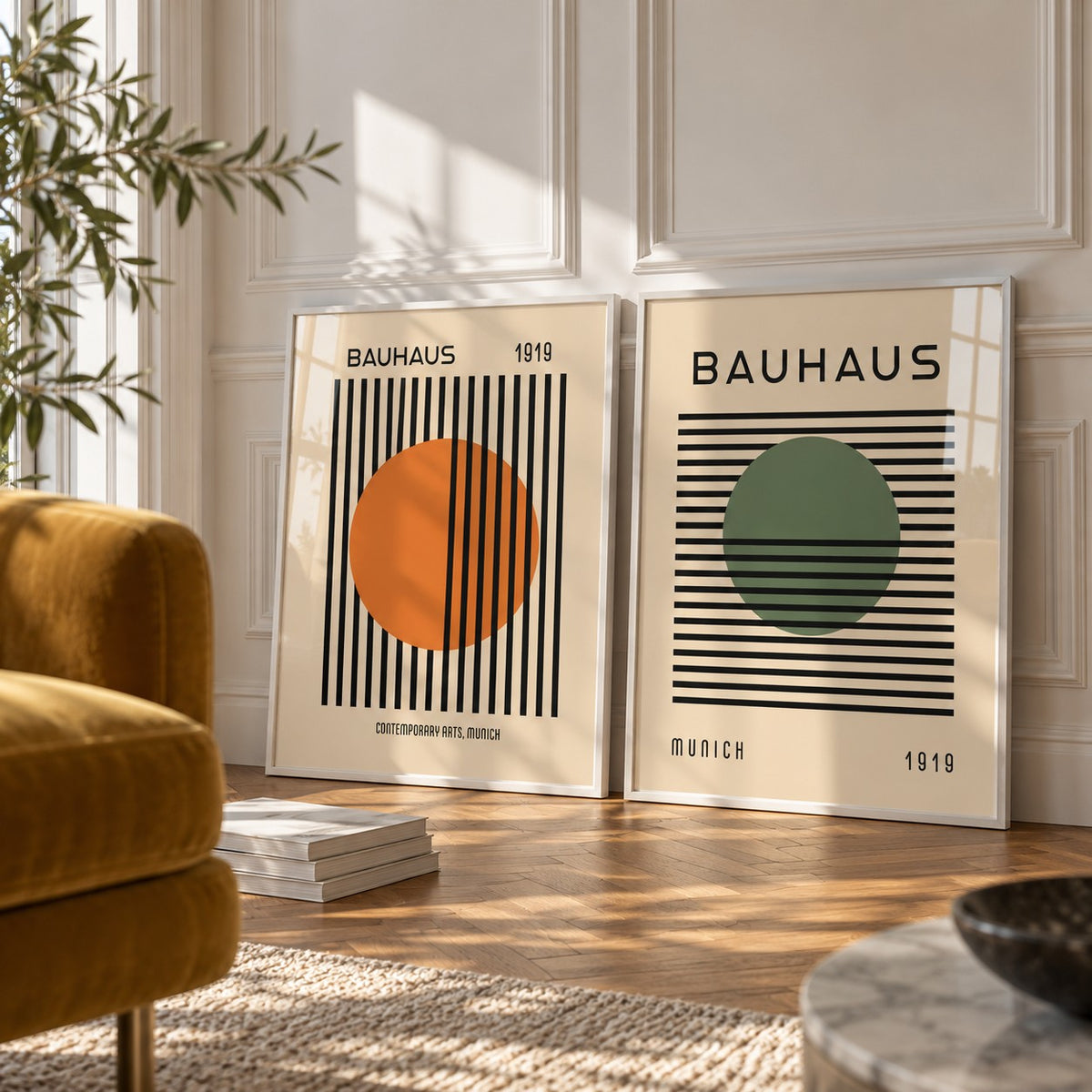 Orange and Green Wall Art Set of 2 styled against a white panelled wall behind a mustard velvet armchair: Striped Sun and Modern Orb shown framed side by side (frames not included)