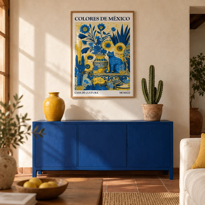 Otomi Wall Art, framed on the wall of a warm Mexican-modern living room with plain limewashed cream plaster walls and a terracotta floor