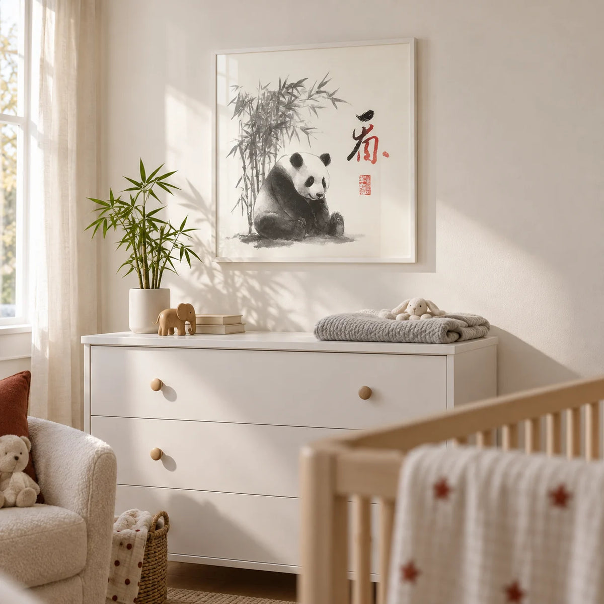 Panda Art Print, framed on the wall of a calm neutral nursery with a warm white wall