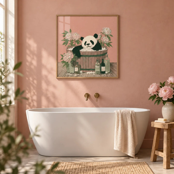 Panda Bath Print, framed on the wall of a calm bathroom with a plain dusty pink plaster wall and a white freestanding bath