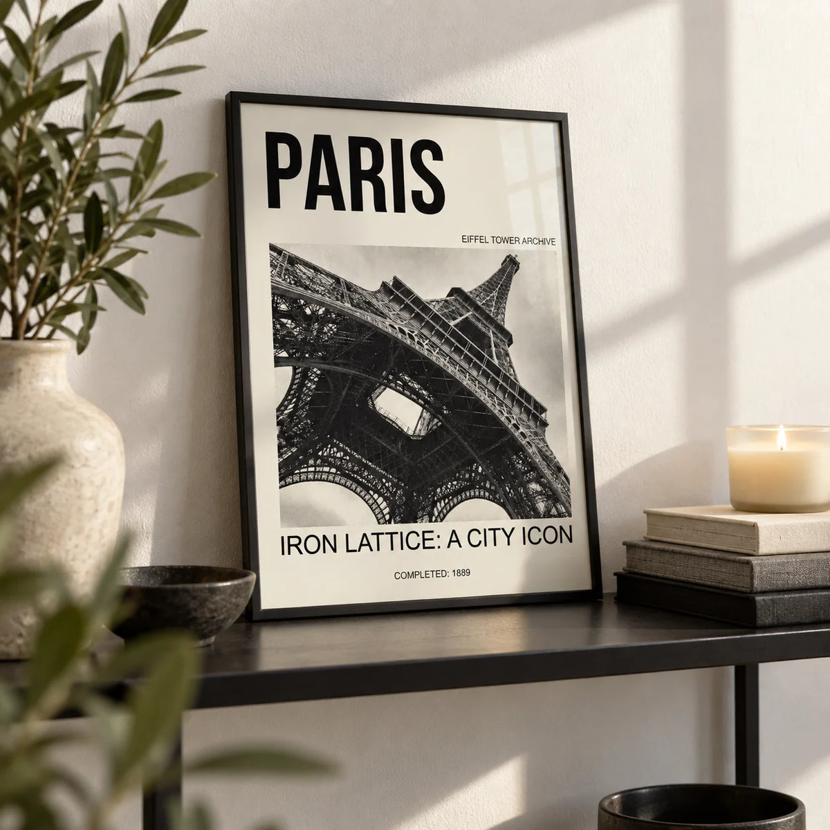 Paris Eiffel Tower Print, a small A4 framed print leaning on a black metal shelf in a living room