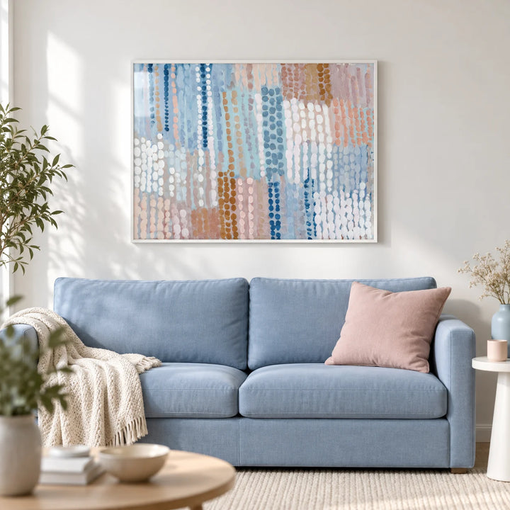 Pastel Blue And Pink Abstract Prints, framed on the wall of a light modern living room with a white wall
