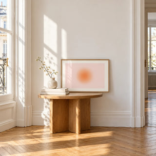 Peach Aura Print, a small A4 framed print leaning on a small solid oak side table
