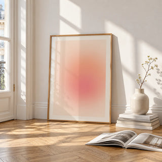 Peach Print, framed and leaning on the parquet floor of a bright living room