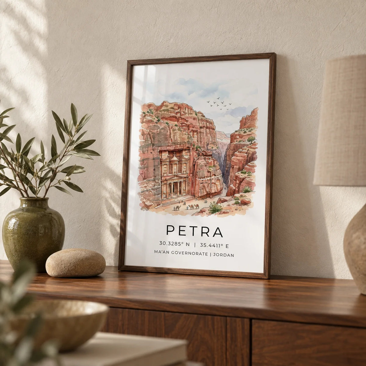 Petra Art Print, a small A4 framed print leaning on a walnut sideboard in a living room