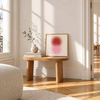 Pink and Red Print, a small square framed print leaning on a small solid oak side table