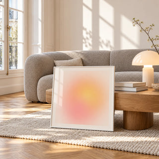 Pink and Yellow Print, framed and leaning against a coffee table in a bright living room