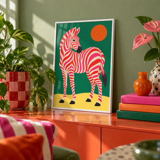 Pink Zebra Poster, a small A4 framed print leaning on a colourful lacquered shelf in a living room