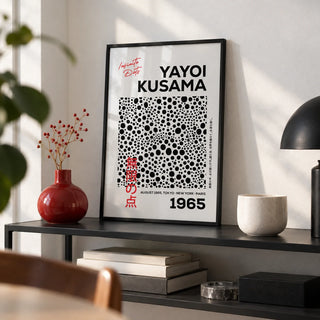 Polka Dots Art, a small A4 framed print leaning on a black metal shelf in a living room