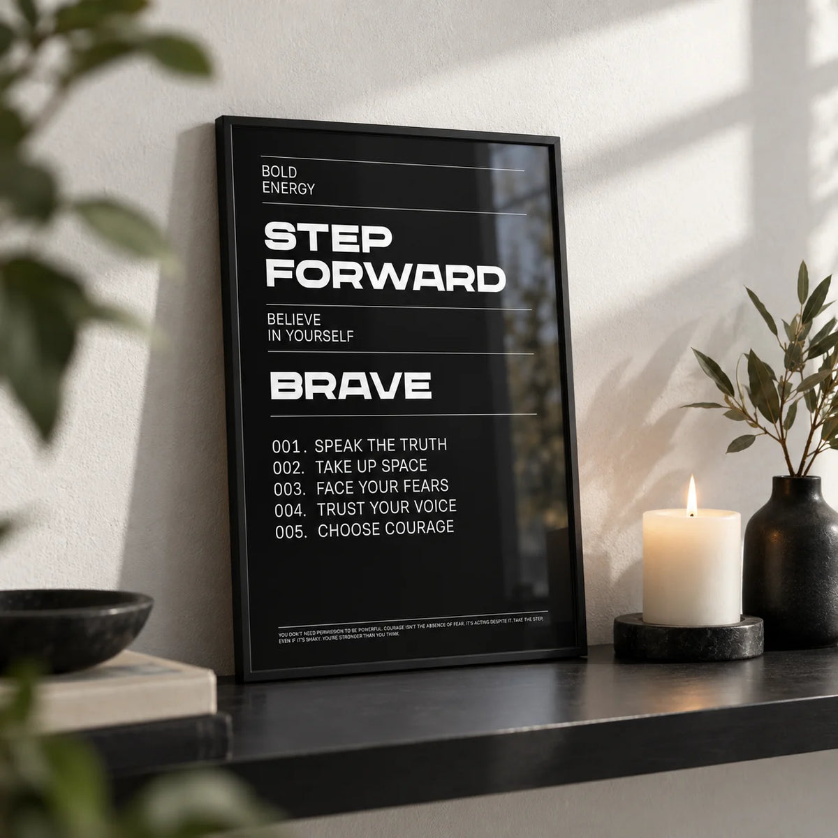 Positive Affirmation Prints, a small A4 framed print leaning on a black shelf in a living room