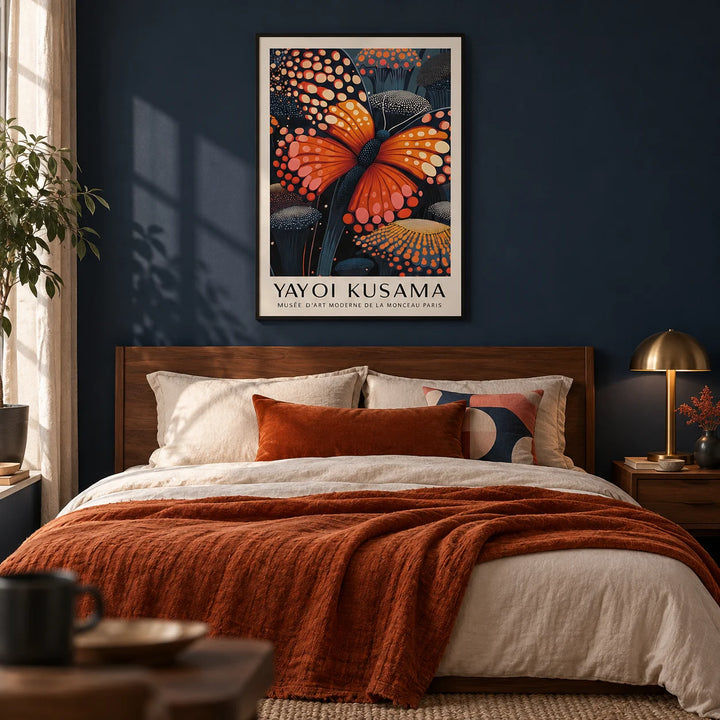 Poster Butterfly, framed on the wall of a moody bedroom with a deep navy painted wall