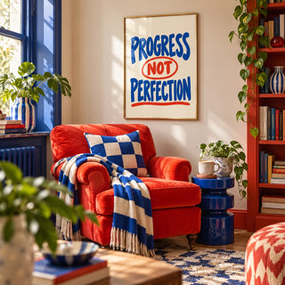 Progress Not Perfection Print, framed on the wall of a maximalist reading corner in a living room