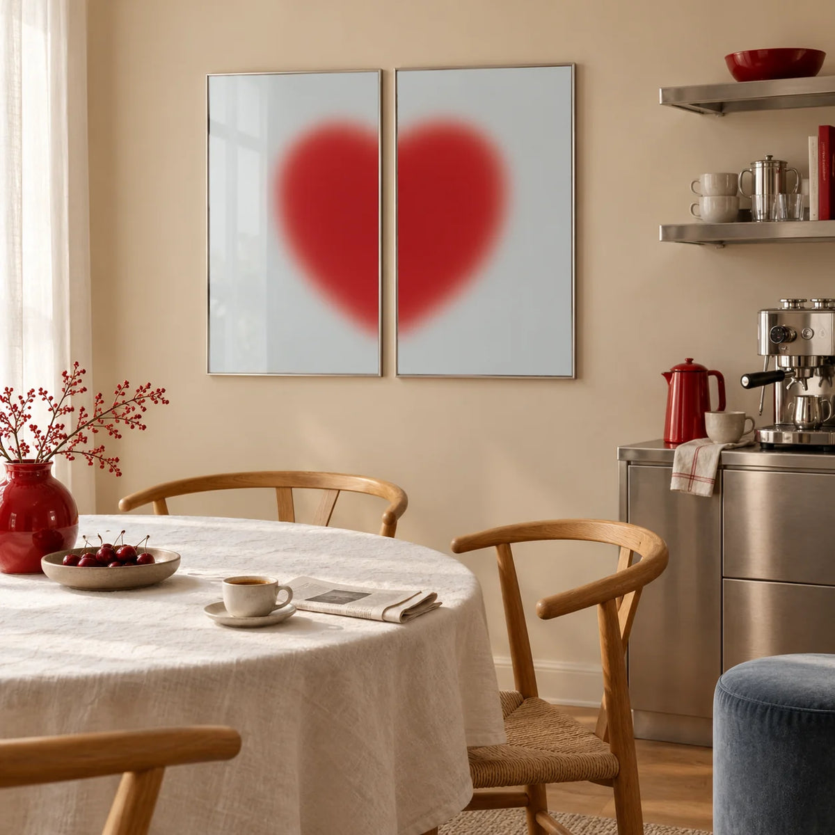 Red heart print set of 2 hung above a dining table in a warm kitchen