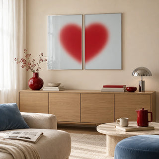 Red heart print set of 2 leaning on an oak sideboard in a living room