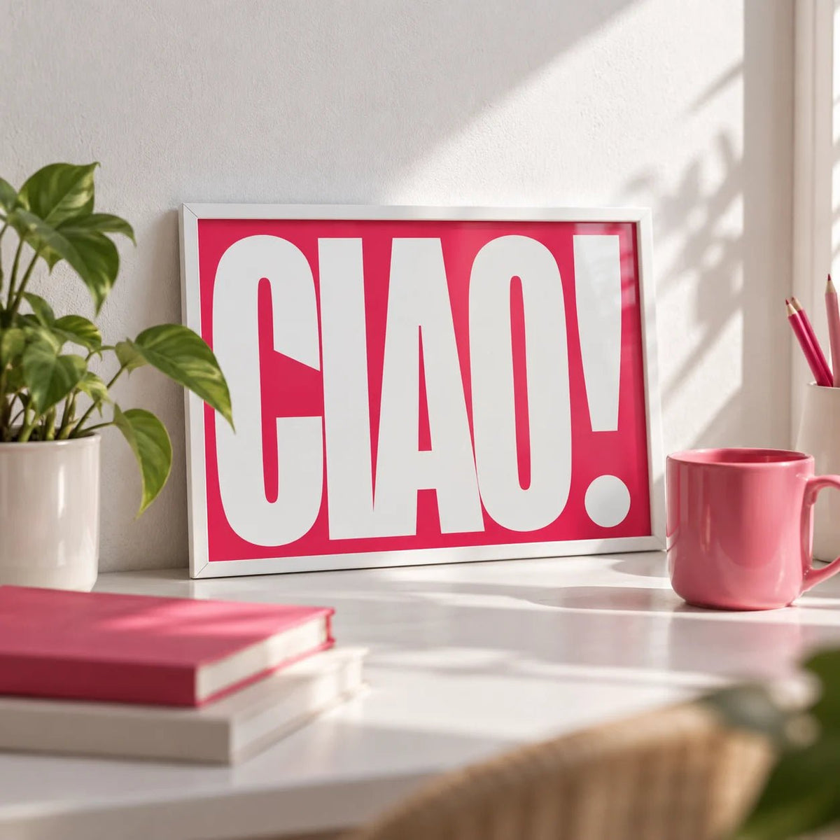 Red Text Print, a small A4 framed print leaning on a white desk