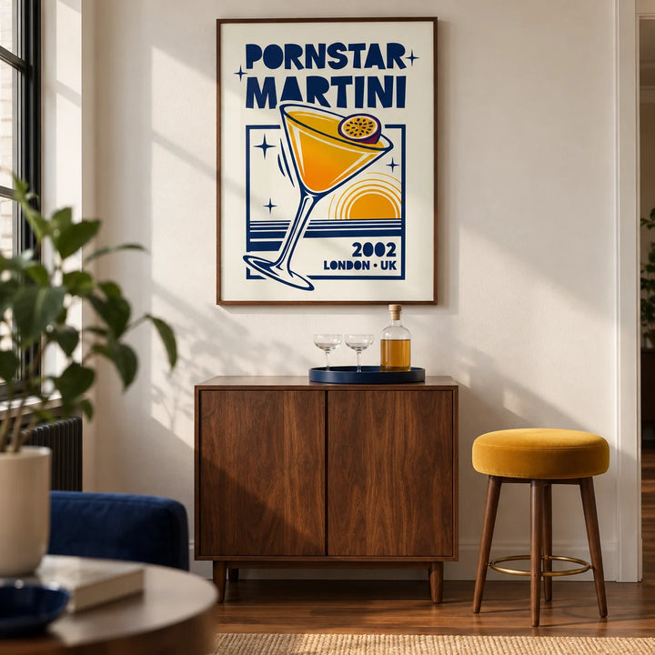 Retro Passion Fruit Martini Poster, framed on the wall of a retro-inspired home bar in a UK city flat with an ivory wall and walnut flooring in a living room