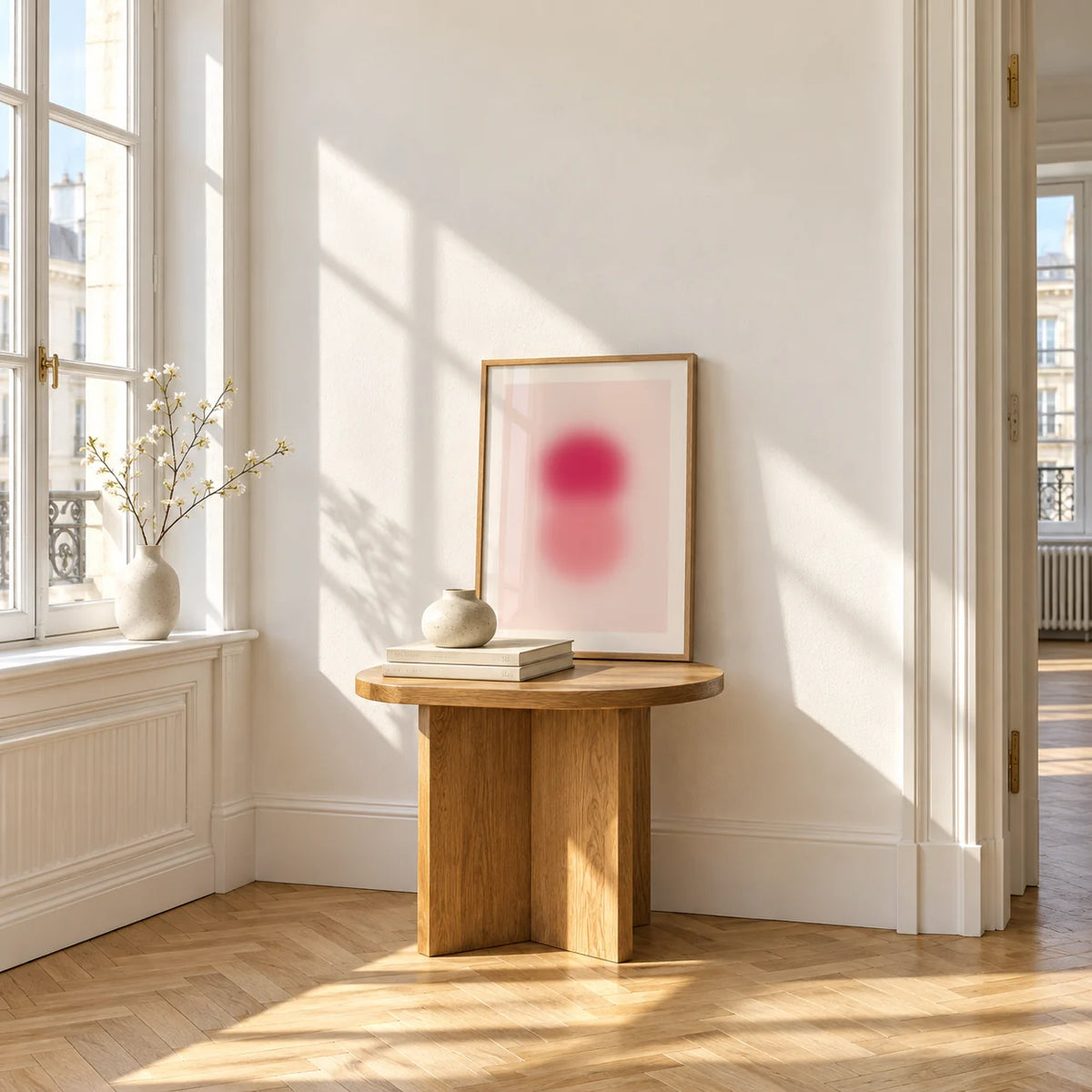 Rose Pink Wall Art, a small A4 framed print leaning on a small solid oak side table