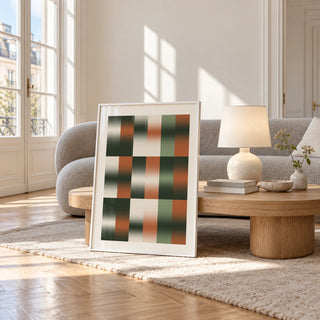 Sage Grid Print, framed and leaning against a coffee table in a bright living room