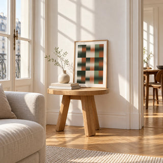 Sage Grid Print, a small A4 framed print leaning on a small solid oak side table