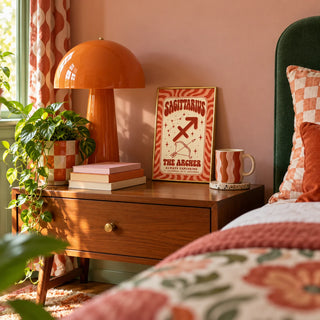 Sagittarius Print, a small A4 framed print leaning on a bedside table