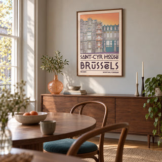 Saint Cyr House Poster, framed on the wall of a compact dining room in a design-conscious UK flat with warm grey walls and a tall sash window