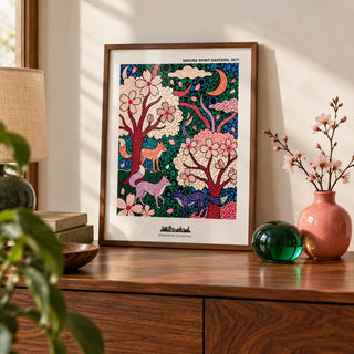 Sakura Spirit Wall Art, a small A4 framed print leaning on a walnut sideboard in a living room